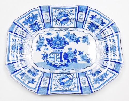 A 19thC Ridgeway blue and white stone china meat plate, decorated with vase, flowers in Oriental style, 54cm wide.