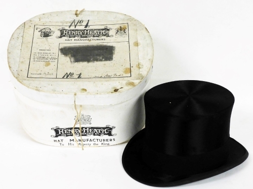 An early 20thC Henry Heath Ltd silk top hat, in original box, inside circumference approximately 56cm.