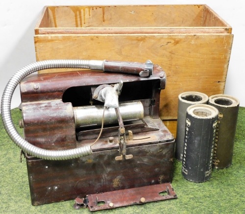 An Edison type dictaphone, with three wax cylinders. (AF)