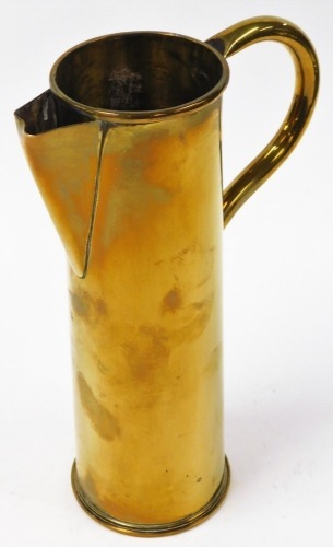 A brass shell case converted to a jug, the shell case stamped 4/16 EWBC, with conversion with spout and handle, 29cm high.
