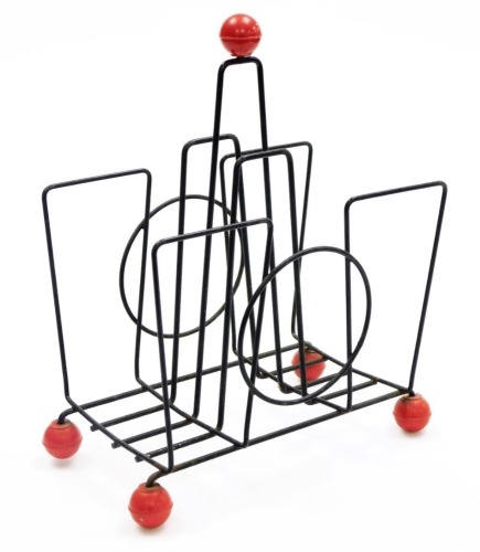 A 1950/60s 'Sputnik' wirework magazine rack, with red ball finial, on four red ball feet, 33cm high.