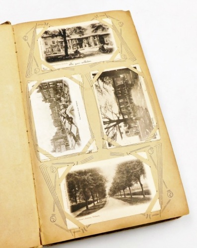 An album of 20thC and later postcards, etc., to include topographical scenes of seaside towns, Brighton, Bournemouth, family portraits, humorous, etc. (1 album)