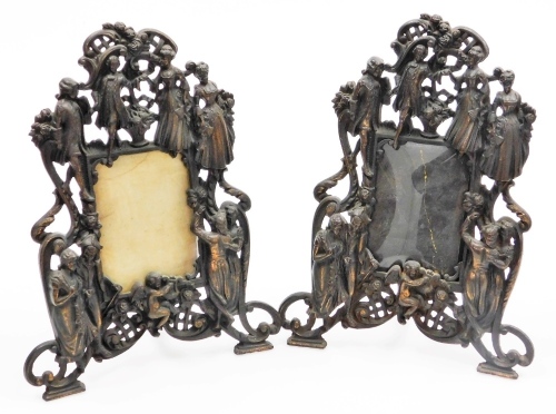 A pair of 20thC cast metal photograph frames, decorated with figures, putti, scrolls, etc., on strut supports. (2)