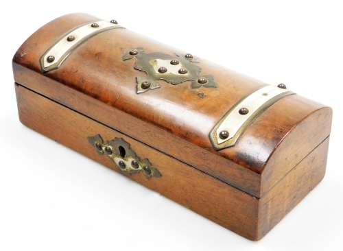 A Victorian walnut glove box, with a domed lid and decorated with brass bands and bone decoration, the hinged lid enclosing a velvet padded interior, 27cm wide.