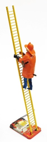 A mid 20thC MAR Toys wind up The Climbing Fireman toy, the fireman 21cm high.