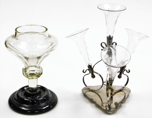 An early 20thC silver plated epergne, with four glass trumpet stems, plated in twine mounted on a tricon base terminating in orb feet, 35cm high.