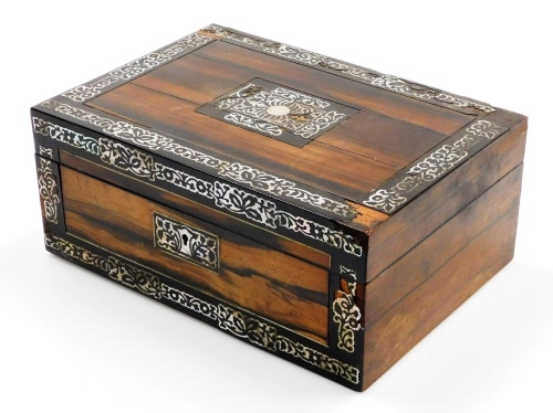 A 19thC coromandel and mother of pearl jewellery box, of rectangular form, with plain central cartouche and elaborate lock escutcheon, with plain interior, 13cm high, 32cm wide, 21cm deep.