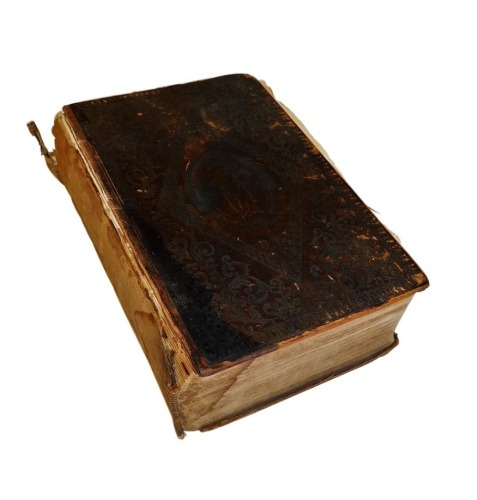 A 19thC leather bound Holy Bible, with inscription dated 1835, with a Christian motto crest to exterior. (AF)