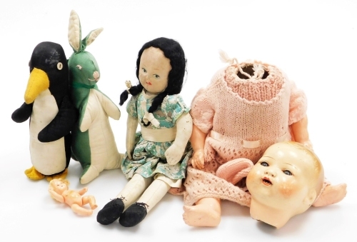 Various dolls related items, etc., stuffed penguin, celluloid head numbered 32, 18cm high, with body, woollen jackets, other clothing, etc. (a quantity)