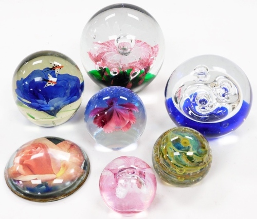 Various boxed paperweights, in associated boxes, to include swirl design 5cm high, another set with butterflies and flower, other orb design, etc. (7)
