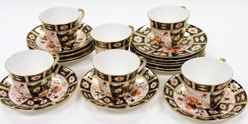 A Royal Crown Derby porcelain 2451 Imari pattern part service, to include plates, 16cm diameter, cups and saucers, settings for six. (many seconds)
