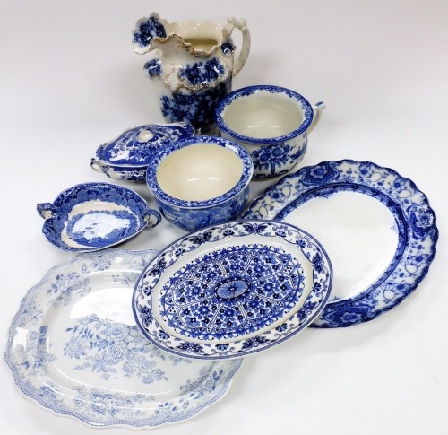 Various blue and white pottery, serving dishes, chamber pot, transfer printed wash jug with gilt highlights, 32cm high, lidded tureen, meat plates, various sizes. (a quantity)