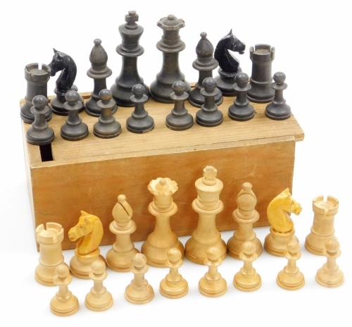 A 20thC Staunton style chess set, comprising black and white figures, the black king 6cm high, in pine box.