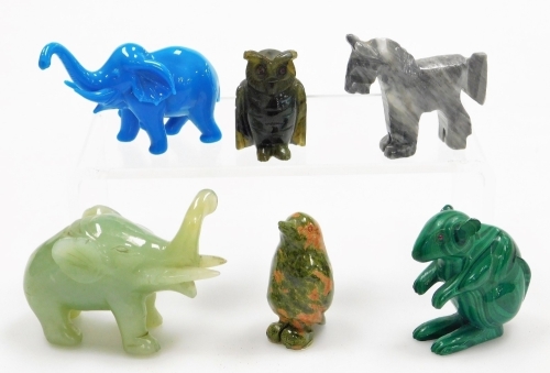 A collection of carved stone animals, to include zebra, elephant, etc., one malachite example. (AF)
