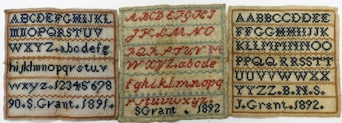 A Victorian alphabetic sampler, by S Grant 1892, 20cm x 19cm, further alphabetic sampler, 1892 and another 1891.