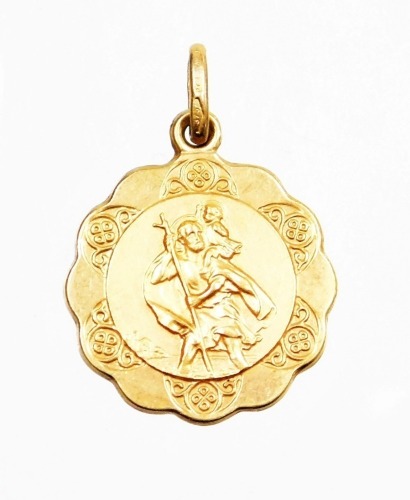 A 9ct gold St Christopher circular pendant, 1.5cm wide, 1.5g all in.