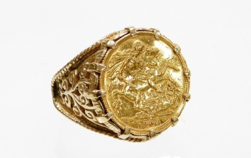 A 9ct gold Edward VII full gold sovereign ring, the sovereign dated 1904 in heavy scroll 9ct gold ring mount, ring size Z plus one, 18.4g all in.