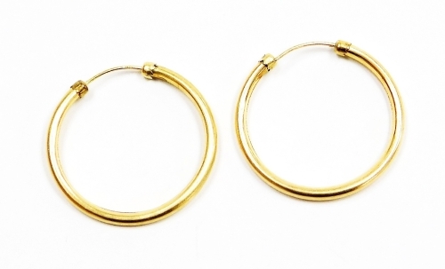 A pair of 9ct gold hoop earrings, 1.1g, 2.5cm drop.