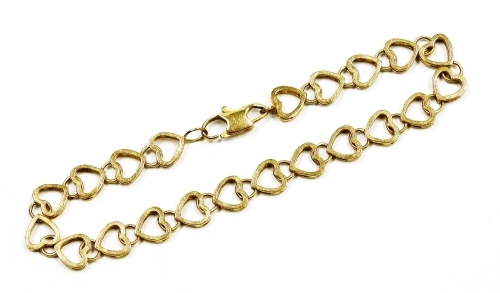 A 9ct gold bracelet, with heart shaped links and clip clasp, 7g, 9cm long.