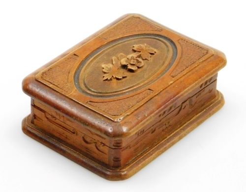 A late 19thC carved stamp box, with hinged lid with oval panel, with flower and leaf design, 7cm x 5cm.