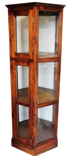 A Jig style hexagonal display cabinet in three sections, on plain base with key, 182cm high, 62cm wide, 64cm deep.