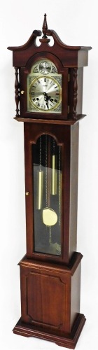 A Highlands granddaughter clock, in mahogany finish case, with arched 16cm dial, stencilled spandrels and Roman numeric chapter ring, in a moulded case with glazed arched door, 152cm high.