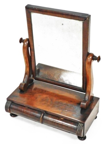 A Victorian mahogany table mirror, the rectangular glass flanked by shaped supports on a cushion base, terminating in compressed orb feet, 54cm high, 39cm wide, 23cm deep. (AF)