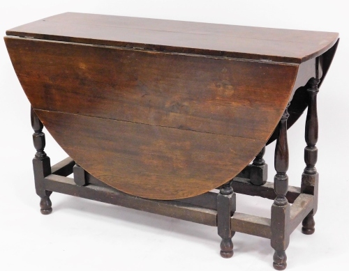 An oak gateleg table, with fold out square chamfered legs, 78cm high, 119cm wide, 42cm deep when closed.
