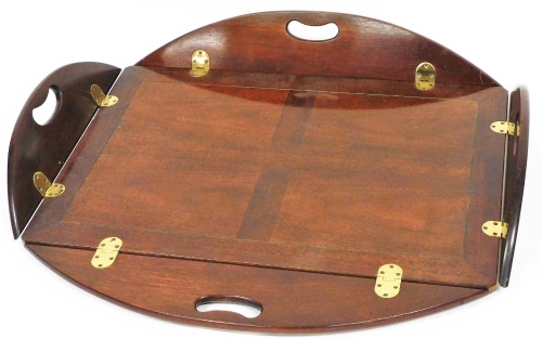 A Georgian style mahogany butlers tray, of shaped rectangular form, with moulded handles, 14cm high, 85cm wide, 57cm deep.