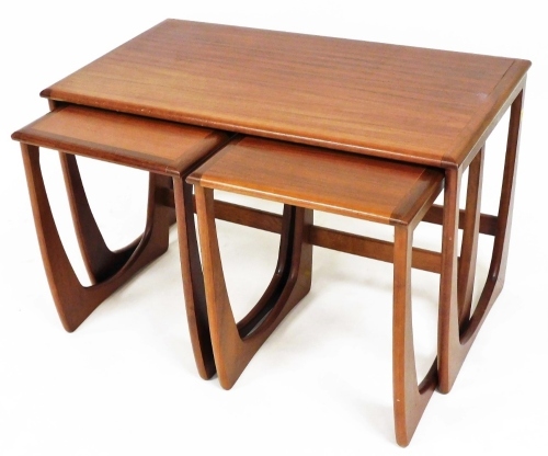 A Sunelm teak nest of three tables, of rectangular form on shaped legs, with two smaller tables, the largest 50cm high, 80cm wide, 47cm deep.