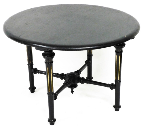 An Edwardian and later occasional table, the circular top on turned parcel gilt reeded legs, joined by an X stretcher, 43cm high, 63cm diameter.