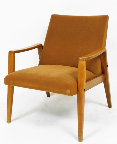 A mahogany armchair, with a padded back and seat, on sabre front legs and shaped arms, 74cm high.&nbsp;