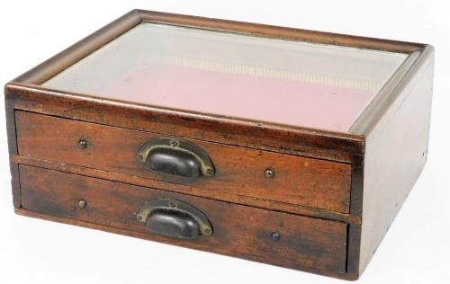 A mahogany display or specimen cabinet, of rectangular form with glass top and two drawers, 18cm high, 44cm wide, 34cm deep.