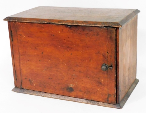 A 19thC mahogany cupboard, of rectangular form with front door and shelf to the interior, on a plain base, 31cm high, 45cm wide, 25cm deep.