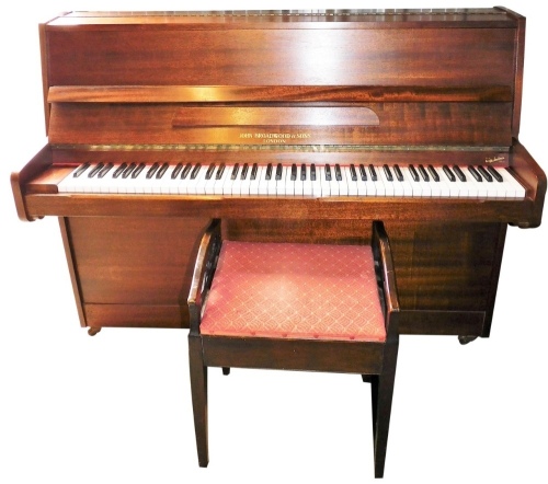 A 20thC John Broadwood & Son over strung piano, 112cm high, 138cm wide, 50cm deep, and an associated Edwardian piano stool. (2)