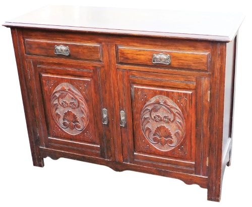 A late Victorian walnut side cabinet, the moulded top raised above two frieze drawers, with double cupboard beneath, on block stiles, 95cm high, 122cm wide, 46cm deep.