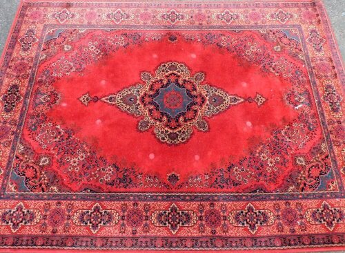 A Louis de Poorteere Belgium mossoul wool rug, red ground, 366cm x 274cm.