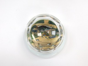 A 19thC faceted cut glass paperweight, decorated internally with a painted three dimensional scene of figures in a town, on opaline circular base, 9cm diameter. - 4