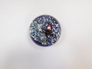 An art glass paperweight, decorated internally with an octopus, starfish and a shell, on a sea bed and blue ground, bears paper label to base, B2024, 8.5cm diameter. - 4