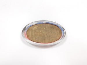 An early 20thC oval glass paperweight, decorated with the R.M.S. Mauretania, in silhouette profile, 11cm wide. - 4