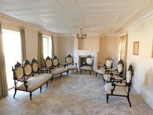 A fine early 20thC French ebonised salon suite, Inc. two & three seater open arm sofas, pair of tripod candle stands/wine tables, narrow display cabinet, 133cm high, 48cm wide, 29cm deep, two plus three open armchairs, oval coffee table, 48cm high, 107cm 