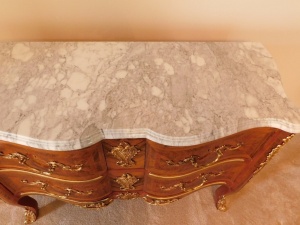 A 20thC kingwood parquetry commode, with marble top, gilt brass adornments to the two drawer front apron and legs, 89cm high, 125cm wide 50cm deep. Provenance: Upon instructions from the executors of Mrs Sandra Mapletoft (Dec'd) who purchased this as Lot - 4