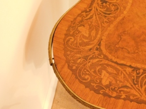 A 19thC kingwood walnut and rosewood marquetry topped serpentine centre table, with gilt metal mounts, 74cm high, 121cm wide, 76cm deep. - 4