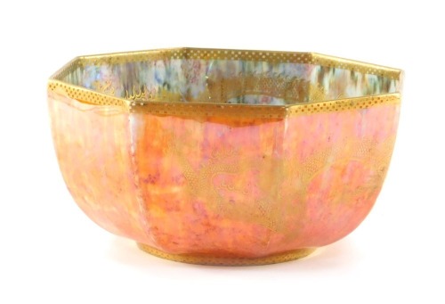 A Wedgwood dragon lustre octagonal bowl, the lustre interior with gilt dragon detail and orange ground exterior, pattern no Z4825, printed and painted marks, 23cm high.