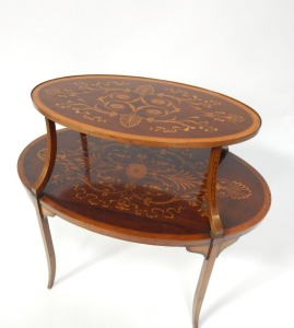 An Edwardian mahogany two tier etagere, with satinwood cross banding, and inlaid with paterae, acanthus leaves, foliate scrolls and ribbons, raised on out splayed legs, 83cm high, 78cm wide, 50cm deep. - 2