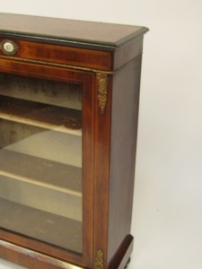 A Victorian walnut pier cabinet, the ebonised edged top over a glazed door, enclosing two shelves, raised on a plinth base and turned ebonies feet, 107cm high, 76cm wide, 30cm deep. - 3