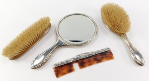 A George V silver dressing table set, comprising a hand mirror, a hair brush, clothes brush and comb, each with Neo Classical engraved decoration, Birmingham 1917. (4) - 2