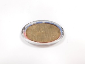 An early 20thC oval glass paperweight, decorated with the R.M.S. Mauretania, in silhouette profile, 11cm wide. - 2
