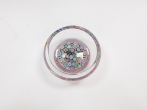 A Peter McDougall millefiori glass dish, with various close canes, bears paper label, 10.5cm diameter. - 2
