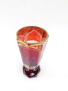 A Bohemian late 19thC ruby flashed glass vase, of octagonal footed form, 'Andenton von Marenbad', together with panels engraved with buildings, comprising Kreuzbrunn, Allesbadhaus, Ambrosinsbr., the ground over gilded with scrolling leaves, 19cm high. - 5